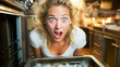 Engaging blonde woman facing the unpleasant task of cleaning a grimy kitchen oven.