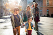 © Marko Geber - Young family having a stroll together in the city