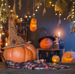 Wall Mural - Halloween pumpkins on old wooden table on background Halloween decorations