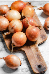 Wall Mural - Fresh onions. On table