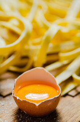 Poster - Homemade pasta tagliatelle. On wooden table.