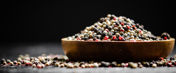 Poster - Peppercorn on rustic background.