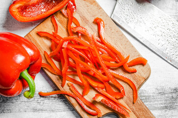 Sticker - Chopped sweet pepper. On white table.