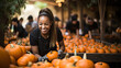 A woman sorts pumpkins at a market