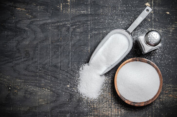 Salt background . On black table.