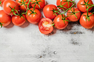 Wall Mural - Fresh tomatoes. On white table.