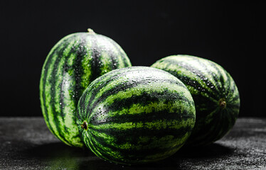 Sticker - Fresh watermelons on table .