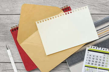 Wall Mural - Stationery mockup. envelope with page for text. on a clean table. Table top view, flat lay, copy space.