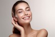 © matteo - Beautiful smiling young woman with clean fresh skin. Facial treatment. Cosmetology, beauty and spa. touch her skin glowing hydrated