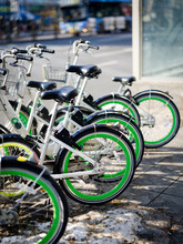 Bright Green Bicycle Wheels In A Sunny City