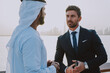 © oneinchpunch - Business team talking about future plans in Dubai