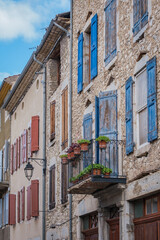 Wall Mural - Narrow street and old house stone facades with shutters in the medieval village of Chatillon en Diois, in the south of France (Drome)