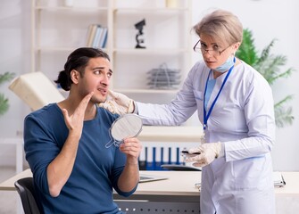 Wall Mural - Young patient visiting doctor in hospital