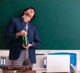 Poster - Male teacher drinking in the classroom