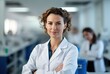 Beautiful young woman scientist wearing white coat in modern Medical Science Laboratory with Team of Specialists on background. Generative AI