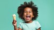 Happy little girl, with curly hair, holding an ice cream on a pastel green background. Generative AI