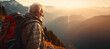 old man climbing a mountain reaching the top - concept - age does not matter