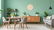 Wooden round dining table and light gray chairs. Dark wood cabinet near green wall. Scandinavian interior design of modern living room