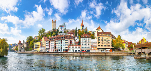 Fabulous historic city center of Lucerne with famous buildings and calm waters of Reuss river.