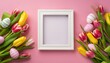 Easter concept. Top view of white photo frame easter eggs and colorful fresh tulips on isolated pink background with copy space