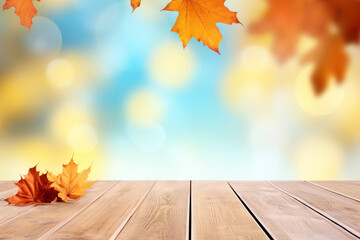 Poster - Wooden table with autumn leaves on bokeh light blue, white and yellow background. High quality photo