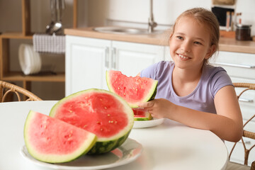 Sticker - Happy little girl with slice of fresh watermelon sitting at table in kitchen