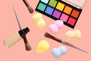 Sticker - Flying makeup accessories and cosmetics on pink background