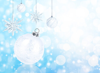 Wall Mural - christmas background with baubles and snowflakes on blue bokeh