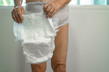 Asian Senior Woman Patient Wearing Incontinence Diaper In Hospital, Healthy Strong Medical Concept.