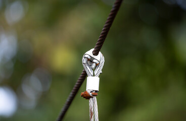 cable on a wire bridge, closeup of photo with shallow depth of field