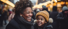 Black Grandmother And Her Grandchild At A Christmas Market