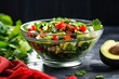 side view of avocado salad with jalapenos in a glass bowl
