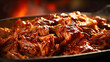 Pieces of pulled beef pork meat with barbeque sauce