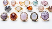 Colorful Gemstone Rings On White Background. Different Sizes, Styles And Shapes Of Rings With Gold And Silver Bands. Great For Themes Of Jewelry, Fashion, Beauty And Luxury.