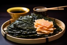 Seaweed Salad Served With Rice Crackers On A Bamboo Plate