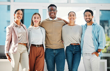 Poster - Portrait of confident business people with smile, hug and team at human resources office. Happy startup employees, men and women standing in workplace together with pride, solidarity and opportunity.
