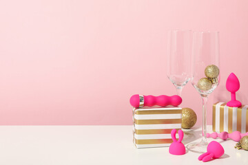 Canvas Print - Sex toy with Christmas decor on a pink background.