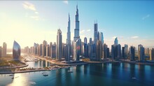 Aerial Image Of The United Arab Emirates Or UAE's Skyline And The City Of Dubai. In A Smart Urban Metropolis, The Financial District And Business District. Skyscrapers And Tall Structures At Dusk.