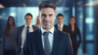 © Synthetica - Portrait of young businessman standing in office.