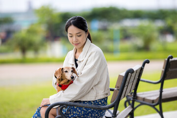 Wall Mural - Woman go out with her dog at park