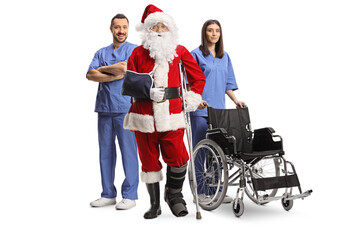 Wall Mural - Injured santa claus with a foot brace and arm sling standing with a medical team