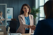 © Madhya Agency - Happy Young Business Woman Manager Handshaking