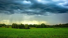 Timelapse Of A Storm Dropping Rain Onto Peaceful Green Fields