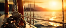 Sailing Boat With Winch And Rope At Sunset On The Sea With Copyspace For Text