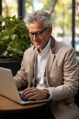 Wall Mural - Adult man Using Laptop in Remote Work, Coworking, with Nomadic Lifestyle