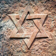Star of David carved in stone close up. Ancient Jewish symbol.