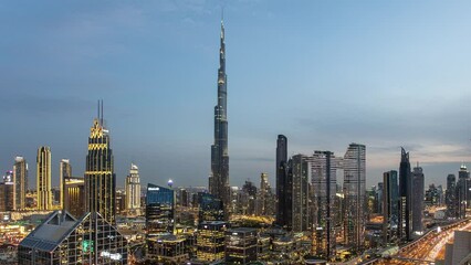 Wall Mural - Time lapse of Burj Khalifa skyline in Dubai from night to day - aerial view, United Arab Emirates