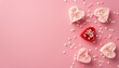 Top view of heart shaped marshmallow, candles and sprinkles on pink background with copy space