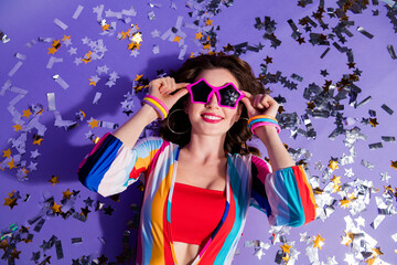 Sticker - Top above high photo of positive lady in 80s style clothes touch glasses on nightclub with confetti isolated purple color background