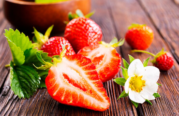 Wall Mural - Fresh ripe organic strawberry on wooden table